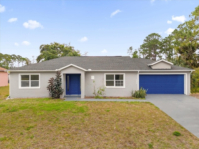 single story home featuring a garage and a front yard