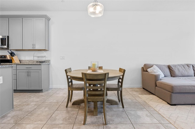 dining room featuring light tile patterned floors