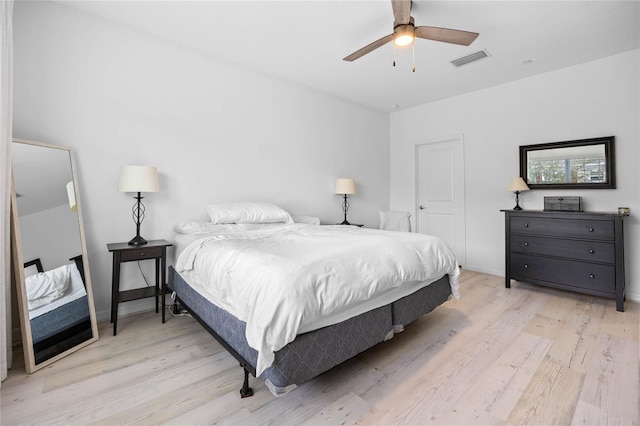 bedroom with ceiling fan and light hardwood / wood-style flooring