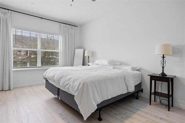 bedroom with light hardwood / wood-style flooring