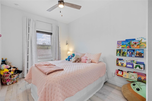 bedroom featuring ceiling fan and light hardwood / wood-style flooring