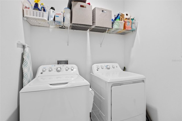 washroom with washing machine and dryer