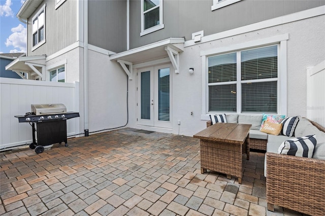 view of patio / terrace with french doors, a grill, and outdoor lounge area