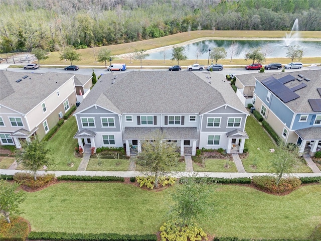 drone / aerial view with a water view