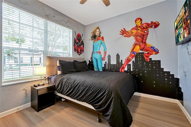 bedroom featuring ceiling fan and light hardwood / wood-style floors