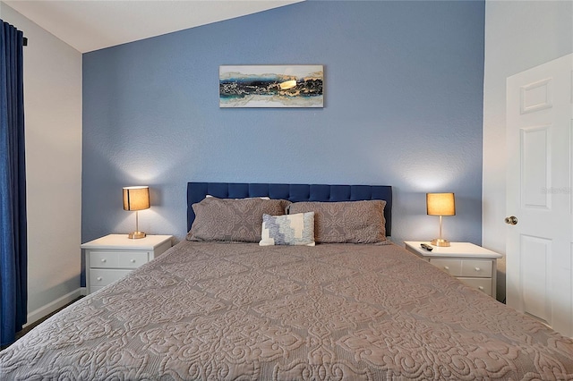 bedroom featuring vaulted ceiling