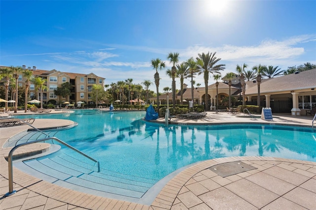 view of swimming pool featuring a patio area