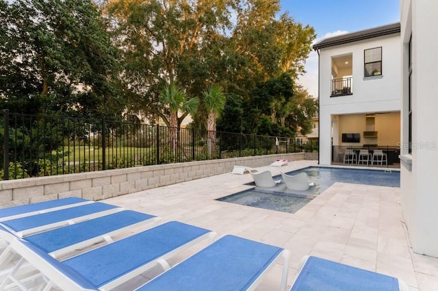 view of swimming pool featuring a patio