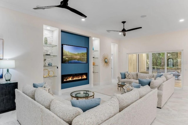 living room with built in features and ceiling fan