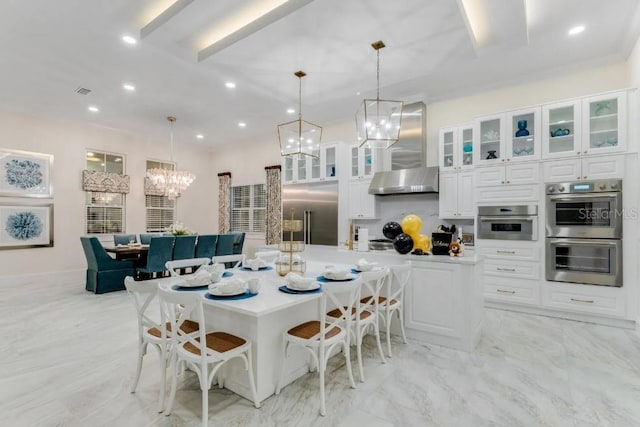 dining space featuring a notable chandelier