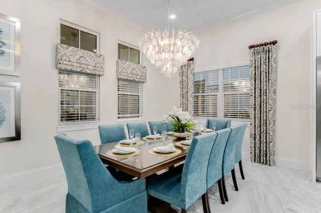 dining space with ornamental molding and a notable chandelier