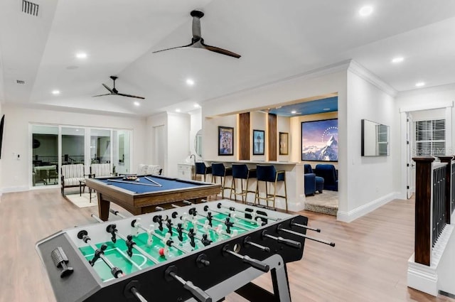 rec room featuring pool table, bar area, ceiling fan, and light hardwood / wood-style flooring