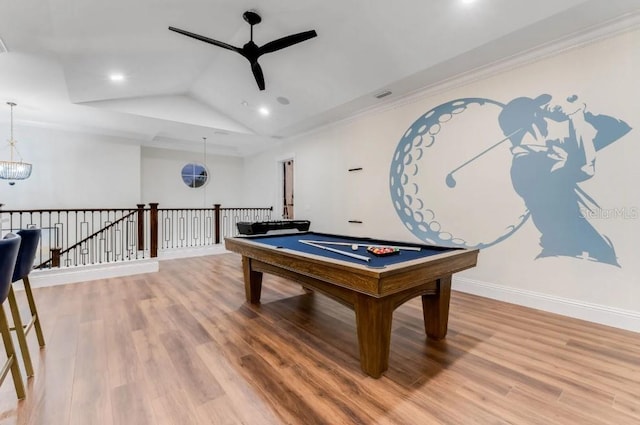 game room featuring vaulted ceiling, billiards, wood-type flooring, and ceiling fan with notable chandelier