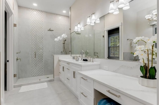 bathroom featuring walk in shower and vanity