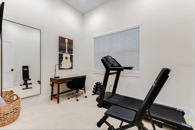 workout room with light colored carpet