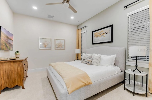 bedroom featuring ceiling fan and light colored carpet