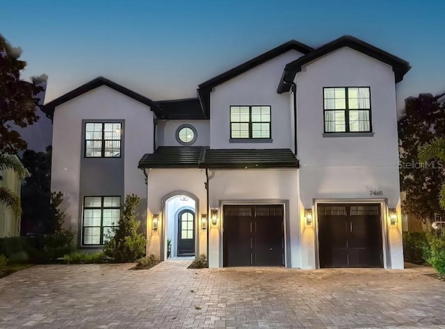 view of front of property with a garage