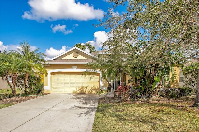 view of front of property featuring a garage and a front lawn