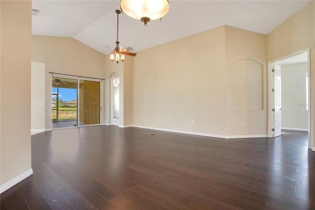 unfurnished room featuring dark hardwood / wood-style flooring, lofted ceiling, and ceiling fan