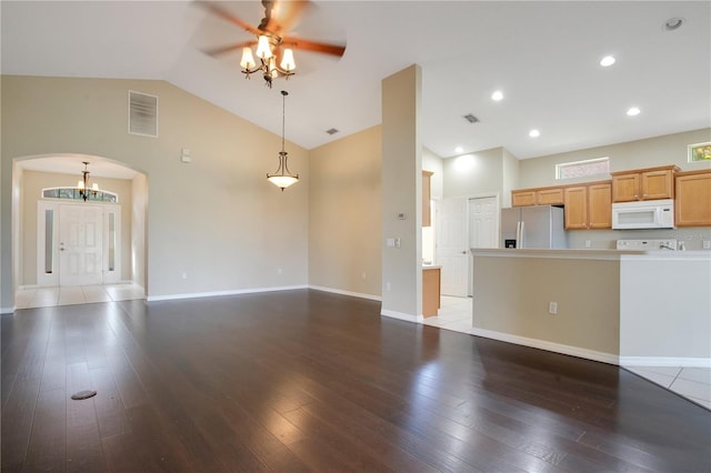 unfurnished living room with hardwood / wood-style floors, high vaulted ceiling, and ceiling fan