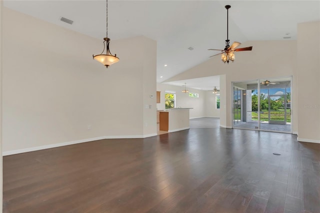 11530 57th Street Cir E, Parrish, FL 34219 - unfurnished living room with a ceiling fan, dark wood-style flooring, baseboards, high vaulted ceiling, and recessed lighting