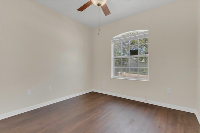 11530 57th Street Cir E, Parrish, FL 34219 - empty room with dark wood-type flooring, a ceiling fan, and baseboards