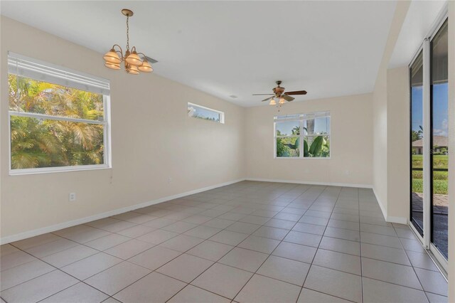 11530 57th Street Cir E, Parrish, FL 34219 - unfurnished room featuring a chandelier, light tile patterned floors, ceiling fan, and baseboards