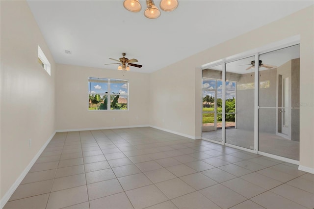 11530 57th Street Cir E, Parrish, FL 34219 - tiled empty room with a ceiling fan, plenty of natural light, and baseboards