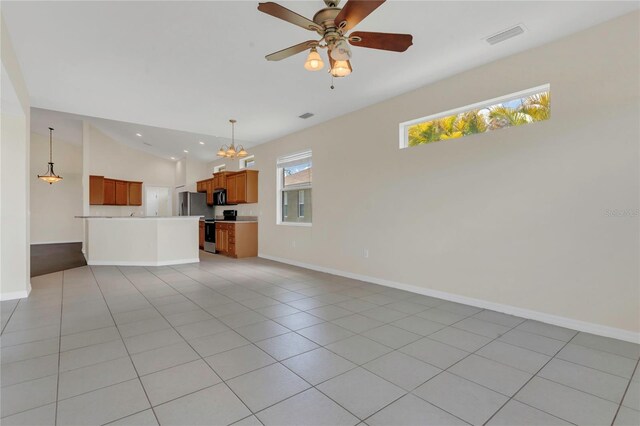 11530 57th Street Cir E, Parrish, FL 34219 - unfurnished living room with a chandelier, baseboards, lofted ceiling, a ceiling fan, and light tile patterned flooring