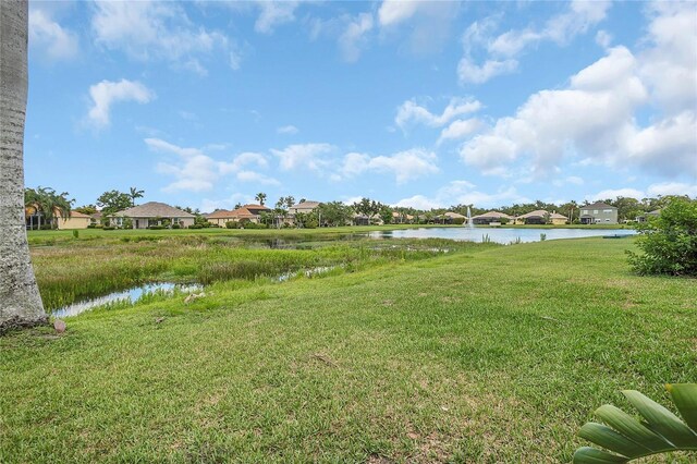 11530 57th Street Cir E, Parrish, FL 34219 - view of grassy yard with a water view and a residential view