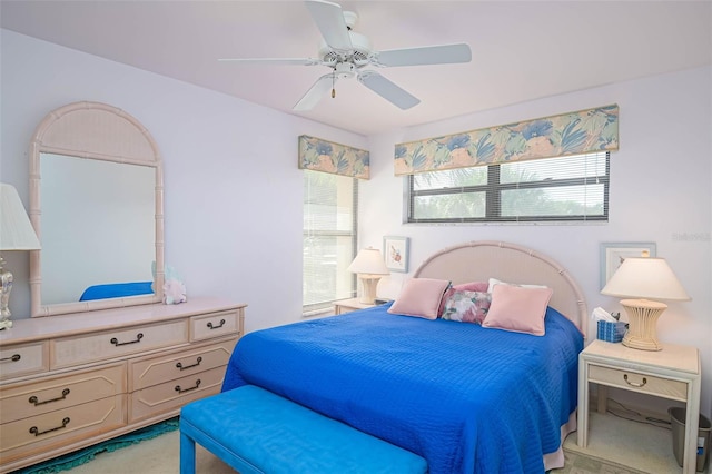 bedroom with light colored carpet and ceiling fan