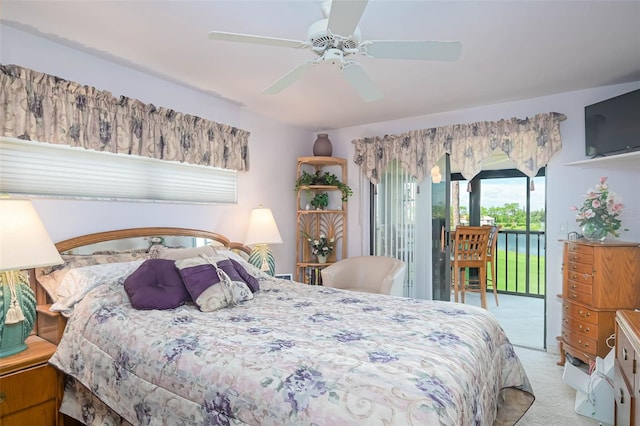 bedroom with light colored carpet, access to exterior, and ceiling fan