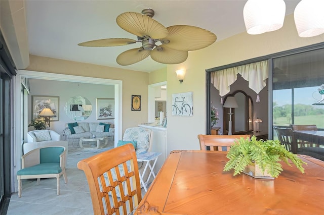 tiled dining space with ceiling fan