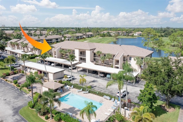 birds eye view of property with a water view