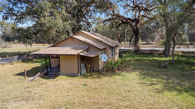 view of outdoor structure with a yard