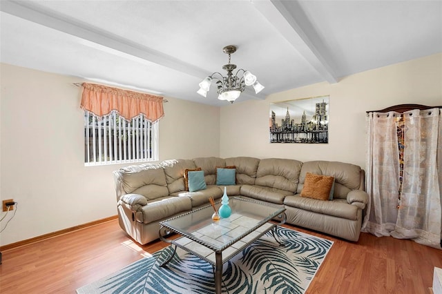 living room with an inviting chandelier, wood-type flooring, and beam ceiling
