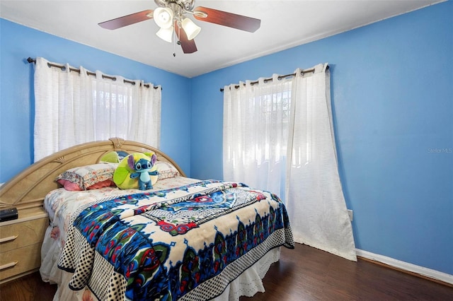 bedroom featuring ceiling fan and dark hardwood / wood-style floors