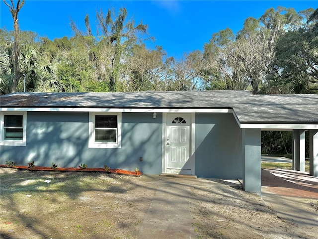 exterior space with a carport