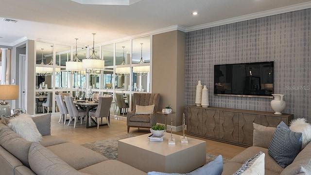 living room featuring ornamental molding and light parquet floors