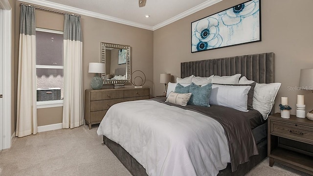 carpeted bedroom featuring ornamental molding and ceiling fan