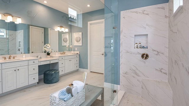 bathroom with vanity and tiled shower