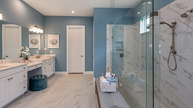 bathroom with vanity and a tile shower