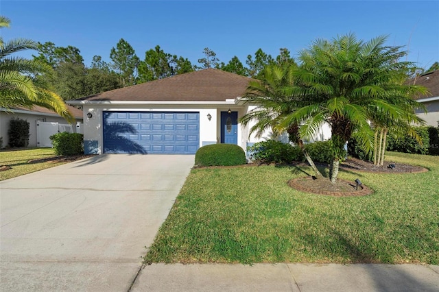 ranch-style house with a garage and a front lawn