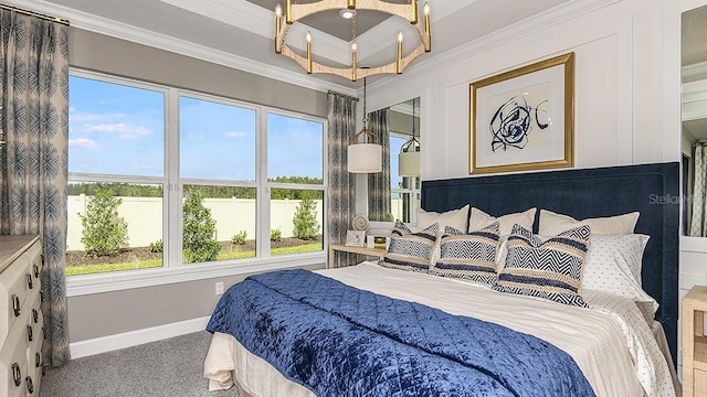 bedroom featuring ornamental molding and a notable chandelier