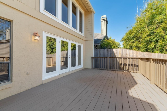 wooden terrace with french doors and fence