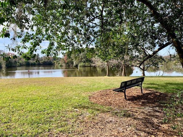 426 Club Dr, Winter Springs, FL 32708 - view of community featuring a water view and a yard