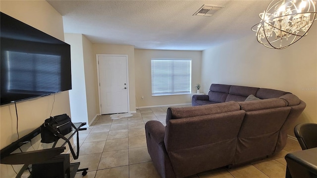 living room featuring light tile patterned floors and a textured ceiling