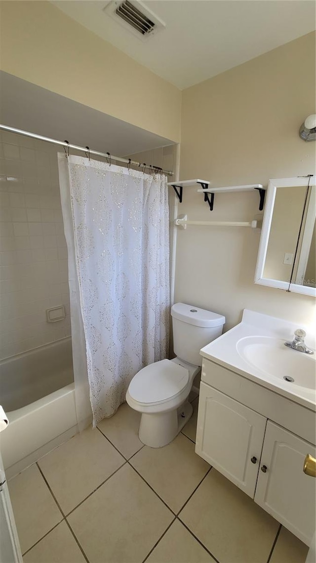 bathroom featuring visible vents, toilet, shower / bath combo with shower curtain, vanity, and tile patterned floors