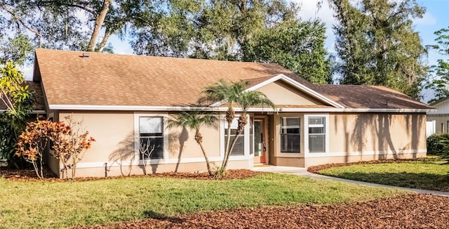 rear view of property with a lawn