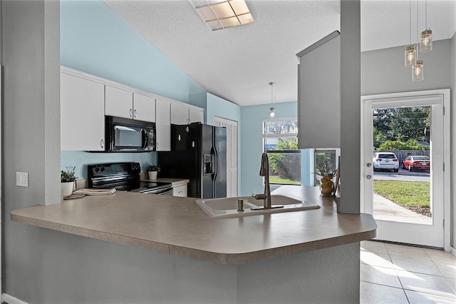 kitchen with sink, black appliances, hanging light fixtures, kitchen peninsula, and white cabinets